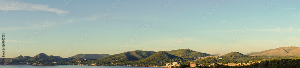 Naklejka premium Panoramic view of the coast of the Majorcan town of Capdepera at sunrise. Spain