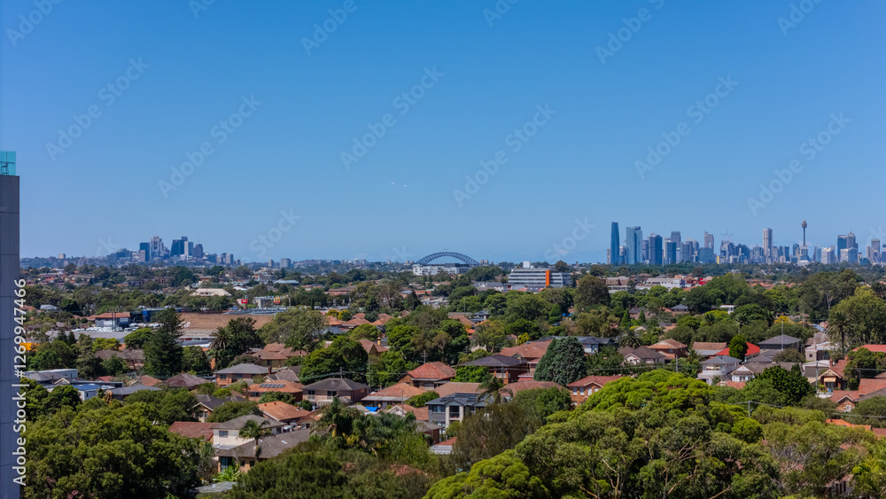 Fototapeta premium Aerial drone view above western Sydney of Rhodes and Wentworth point with views of buildings and Sydney Harbour NSW Australia 
