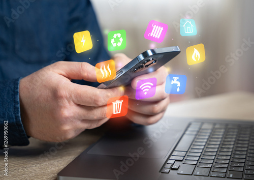 Φωτογραφία The man pays household bills for services and utilities via phone or internet