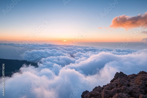 Majestic sunrise over clouds reveals vibrant colors blending bea photo