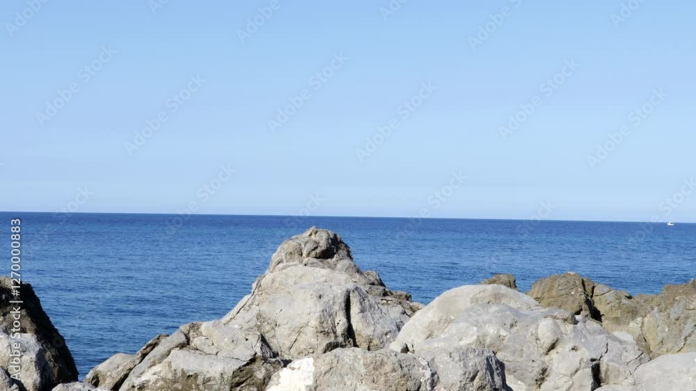 Coastal cliffs against calm sea Coastal cliffs against calm sea