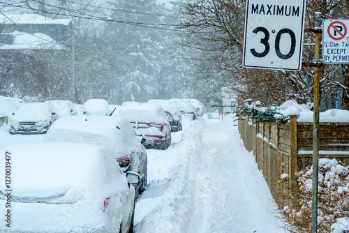 Canvas Print time to dig out: snow covered cars parked on snow choked residential street with