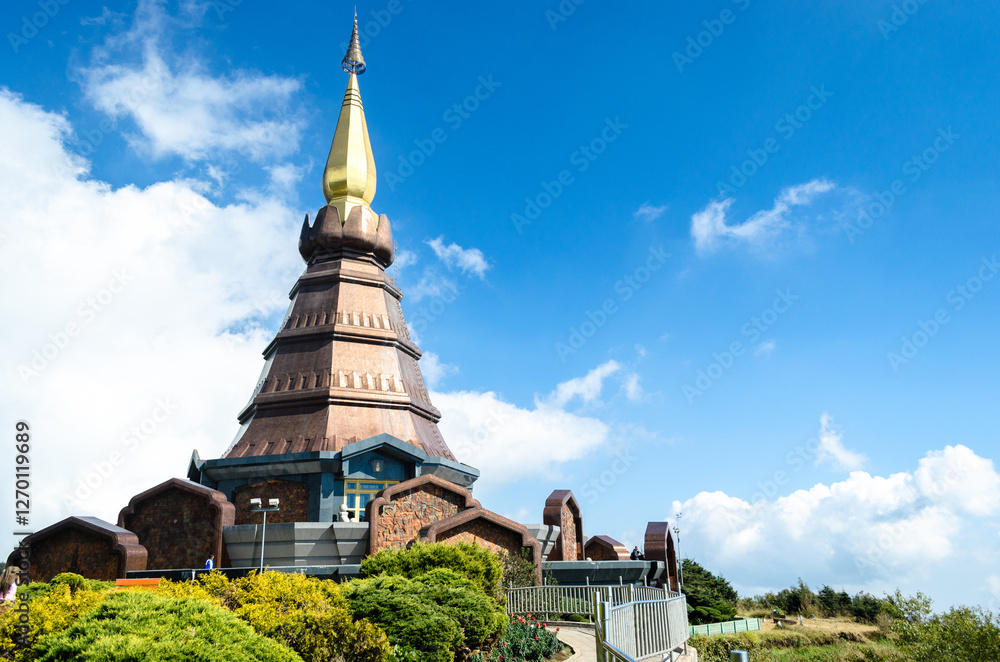 Doi Inthanon Chiang Mai Thailand, Stunning temple with golden spire against blue sky Doi Inthanon Chiang Mai Thailand, Stunning temple with golden spire against blue sky
