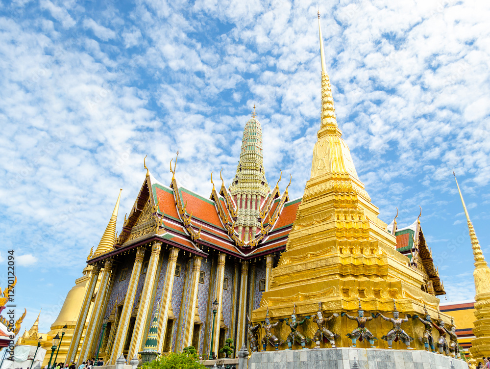 Fototapeta premium Golden temple under a blue sky in Wat Phra Kaew Bangkok Thailand
