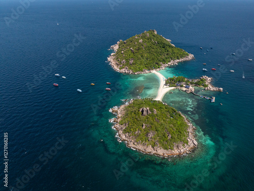 Lush islands with a pristine sandy beach surrounded by turquoise sea. Ko Nang Yuan, Thailand. photo