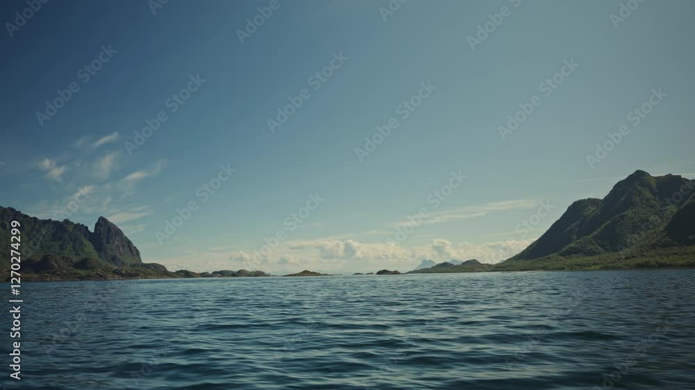 Pov: Speedboat navigating at high velocity in the Norwegian Sea in the Lofoten Islands, Norway. View of the Mountains in the distance. Pov: Speedboat navigating at high velocity in the Norwegian Sea in the Lofoten Islands, Norway. View of the Mountains in the distance.