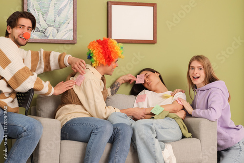 Young people sticking paper...