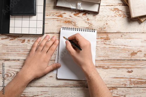 Male hands with notebooks a...