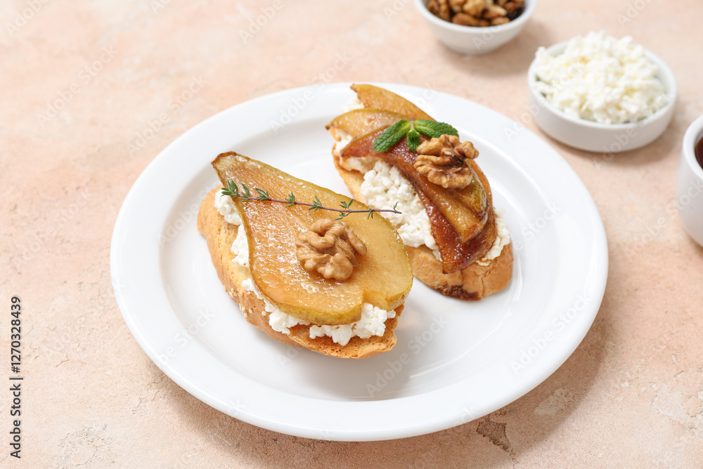 Plate of pear bruschetta with ricotta cheese and walnuts on beige background Plate of pear bruschetta with ricotta cheese and walnuts on beige background