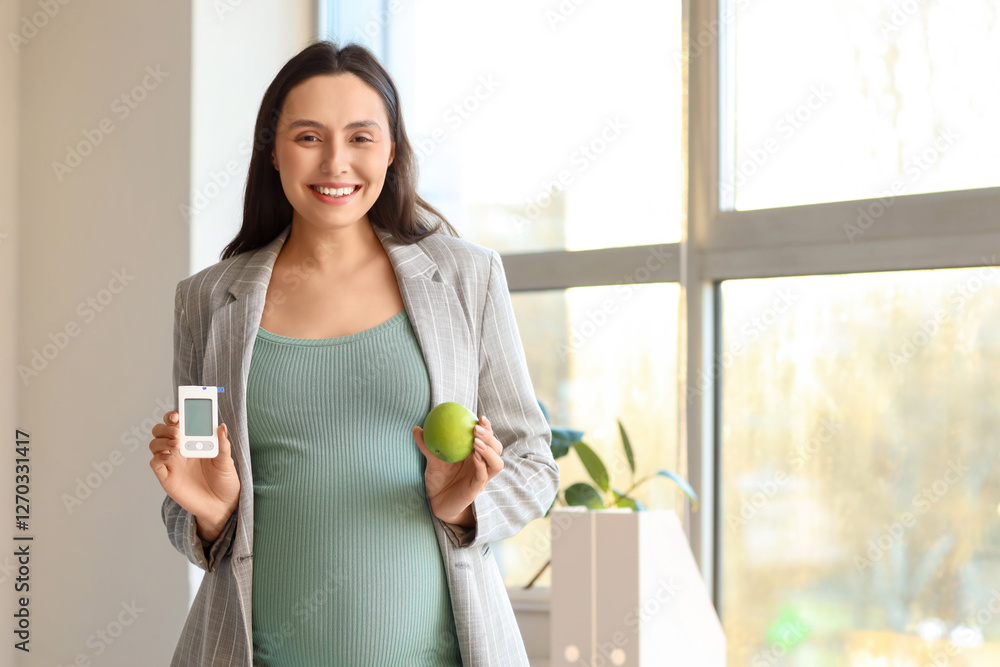 Young pregnant businesswoman with glucometer and apple in office. Gestational diabetes concept Young pregnant businesswoman with glucometer and apple in office. Gestational diabetes concept