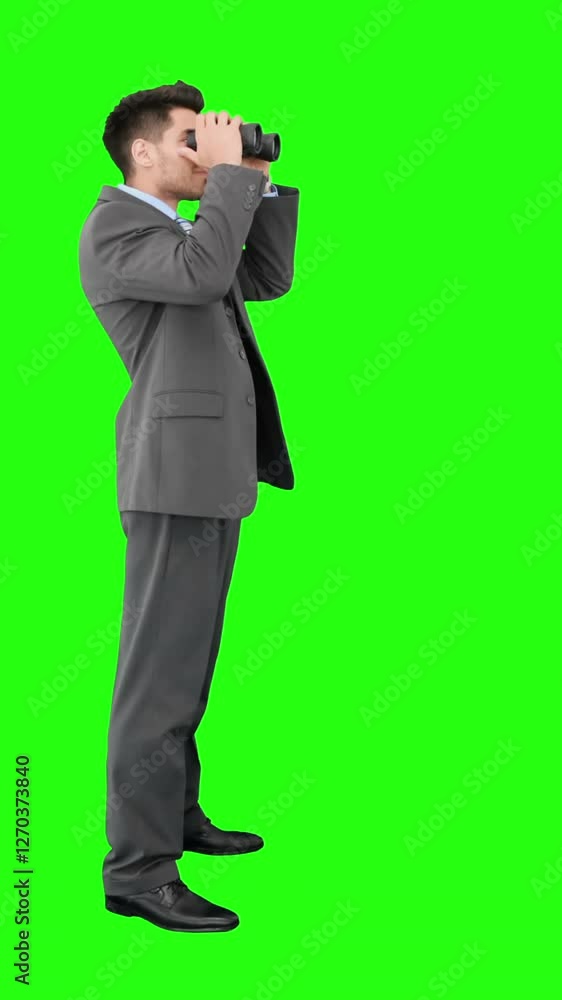 Young businessman looking through binoculars Young businessman looking through binoculars