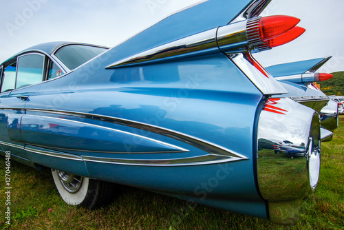 Photography vintage 60's era antique car rear quarter with taillights and whitewall tires