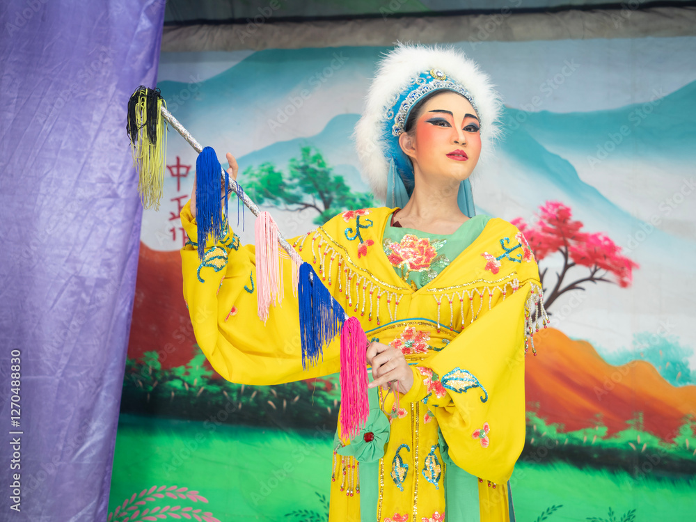 Beautiful young woman with Chinese Opera dress in Chiang Mai, Thailand.
