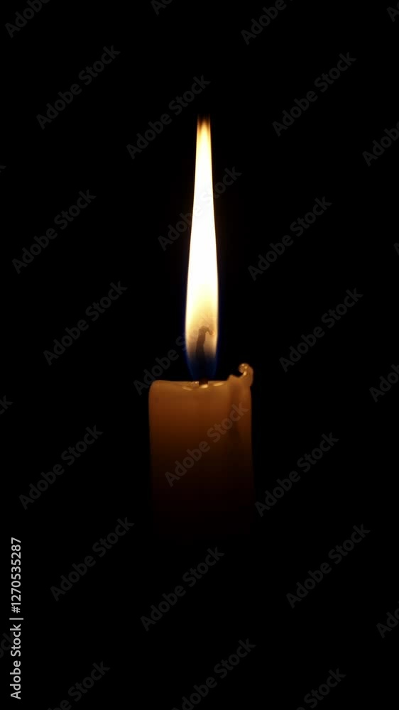 Warm light emanates from a single candle burning steadily in complete darkness, its flame flickering gently, creating a peaceful and contemplative atmosphere Warm light emanates from a single candle burning steadily in complete darkness, its flame flickering gently, creating a peaceful and contemplative atmosphere