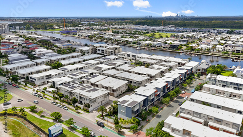 Modern waterfront townhouses on Sickle Avenue, Hope Island, Gold Coast, Queensland