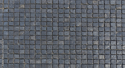 Seamless gray cobblestone wall or road texture background.