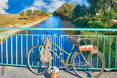 Traditional Dutch Bicycles In Front of Amsterdam Canal. photo