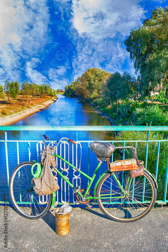 Traditional Dutch Bicycles In Front of Amsterdam Canal. photo