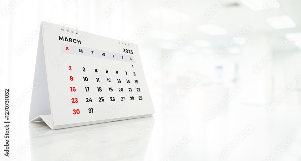 custom made wallpaper toronto digitalMarch 2025 desk calendar on white marble table on blurred office background.