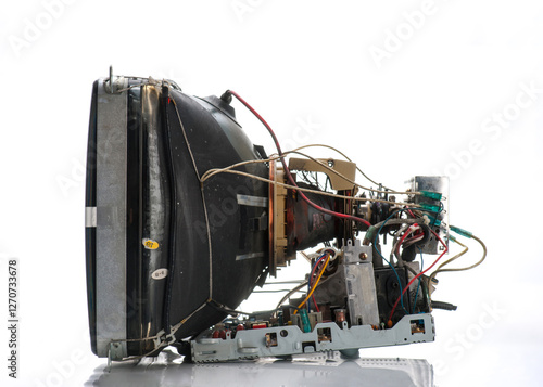 Old television set disassembled showing internal components and wiring in a clean environment