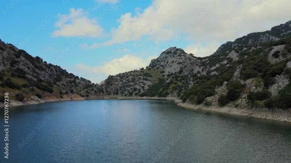 Explore the captivating landscape of Gorg Blau in Mallorca, with its tranquil waters and majestic Sierra de Tramuntana mountains. Perfect for nature lovers and adventurers. Explore the captivating landscape of Gorg Blau in Mallorca, with its tranquil waters and majestic Sierra de Tramuntana mountains. Perfect for nature lovers and adventurers.