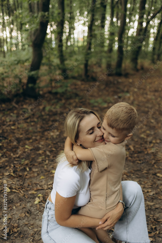 Mother and Son Hugging Tightly in a Serene Forest Setting Mother and Son Hugging Tightly in a Serene Forest Setting