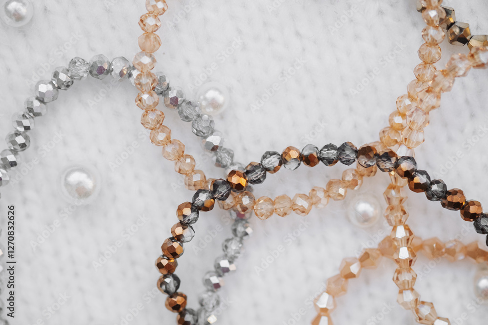Beautifully crafted beaded bracelets on a soft textured surface Beautifully crafted beaded bracelets on a soft textured surface