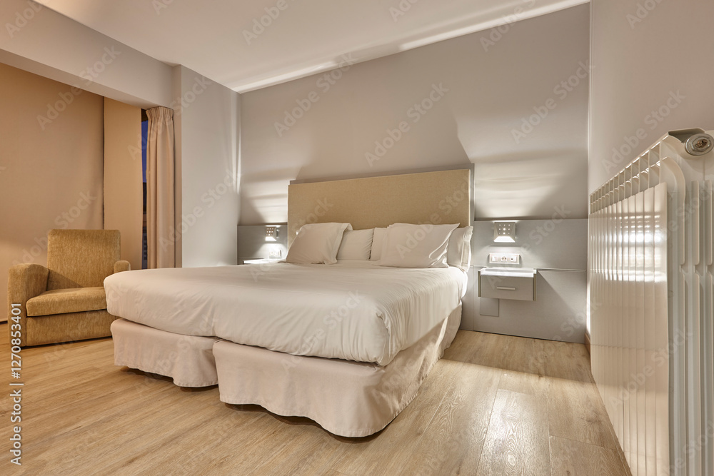 Comfortable hotel room interior. Contemporary apartment bedroom. Modern accomodation.