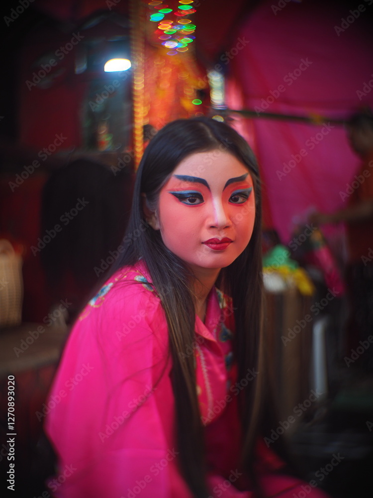 Beautiful young woman with Chinese Opera dress in Chiang Mai, Thailand.