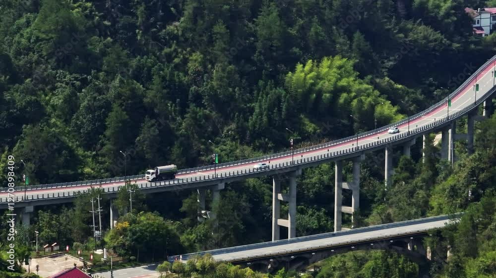 Telephoto drone shot of traffic on highway bridge, in rural China, sunny day Telephoto drone shot of traffic on highway bridge, in rural China, sunny day
