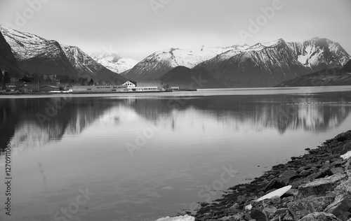 Norwegian Fjord Reflections: Snow-Capped Mountains and Serene Waters