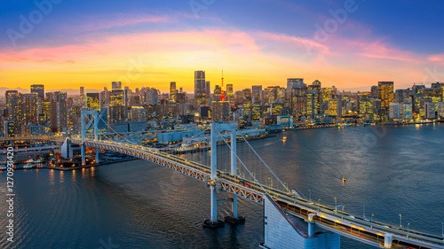 Tableau sur toile Rainbow bridge and Tokyo cityscape at sunset, Japan.