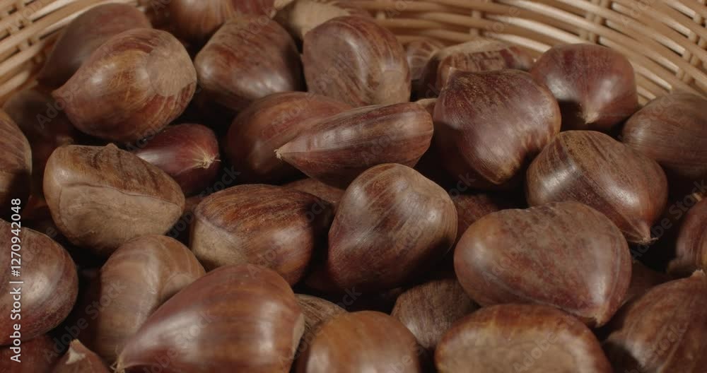 fresh sweet chestnut fruits in a basket closeup rotating selective focus 4k 30fps fresh sweet chestnut fruits in a basket closeup rotating selective focus 4k 30fps