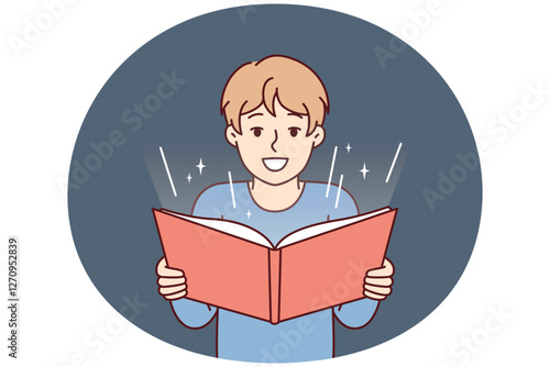 Boy before adolescence with open book in hands reads fairy tale or comics with interest. Student fulfills instructions teacher and is engaged in extracurricular activities studying material from book