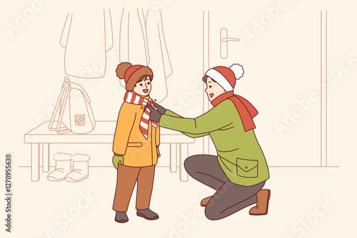 Caring father helps kid put on winter clothes so as not to freeze while walking along cold street. Happy father tying scarf to child showing care and desire to help smiling pre-teen son