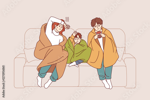 Caught cold family sits on sofa wrapped in blanket and drinks hot tea trying to get rid of virus. Caught cold couple with child contracted infection causing fever and chills and needs medication