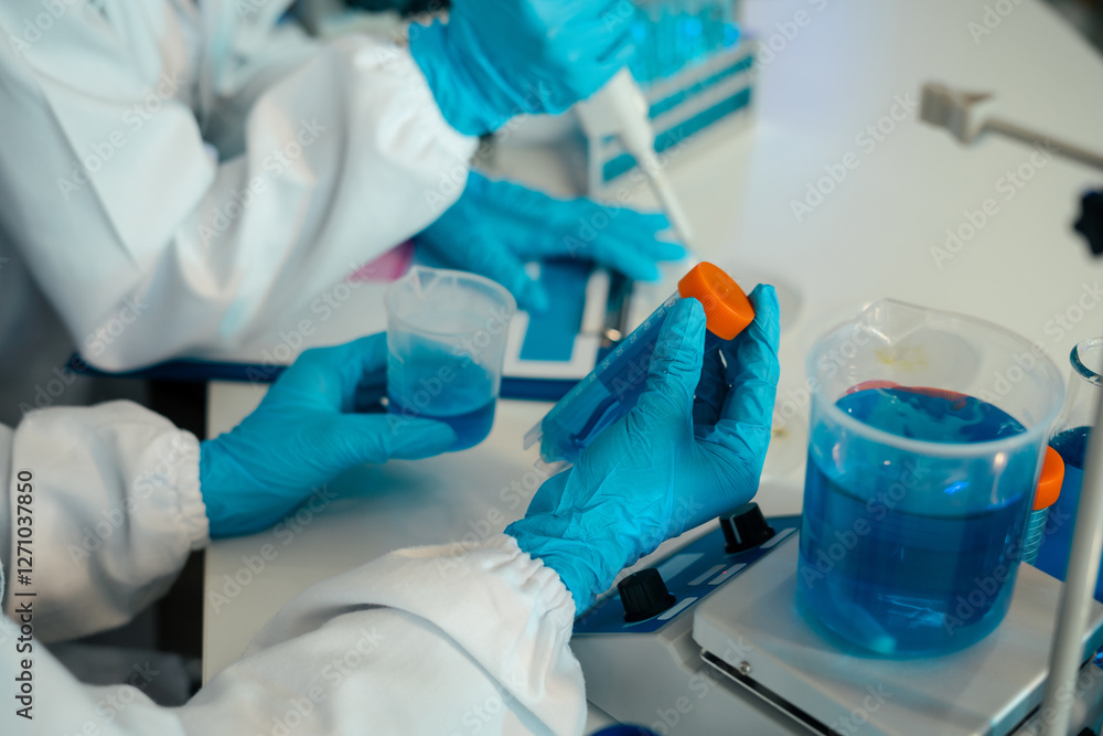 Science and medicine, scientist analyzing and dropping a sample into a glassware, experiments containing chemical liquid in laboratory on glassware, innovative and technology. Science and medicine, scientist analyzing and dropping a sample into a glassware, experiments containing chemical liquid in laboratory on glassware, innovative and technology.