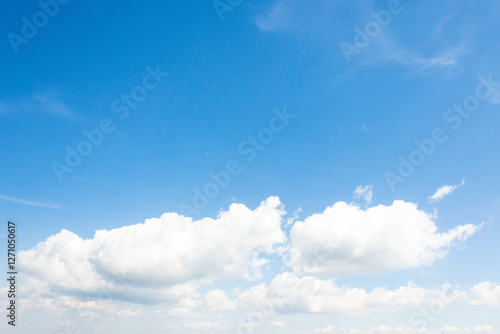 Obraz na płótnie sky with fluffy clouds. dynamic scene in day light. white cumulus cloudscape on a blue gradient of atmosphere. sunny summer weather. scenic nature background. meteorology backdrop. fresh air w salonie