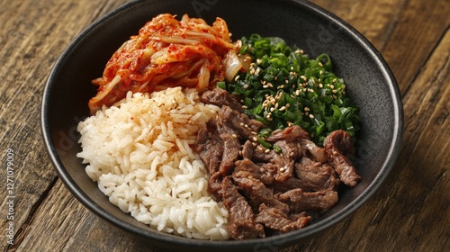 A hearty serving of traditional Korean beef bibimbap in a black bowl, featuring a variety of ingredients like rice, vegetables, and meat, with a spicy sauce on top.