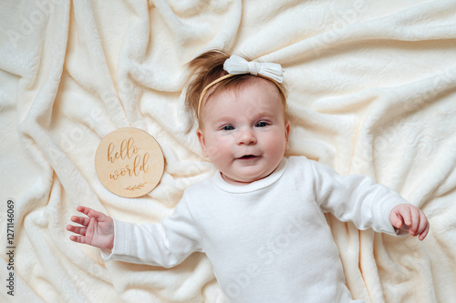 Portrait of a cute, healthy newborn girl with a bow on her head, perfect for baby care and newborn promotions photo