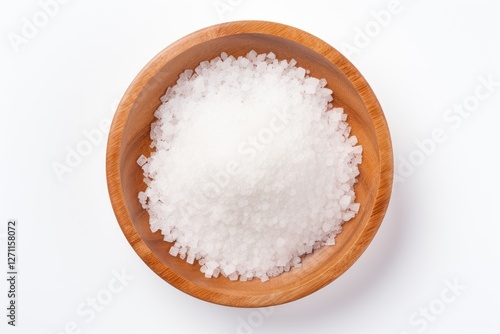 Top view of salt crystals on a wooden plate against a white background
