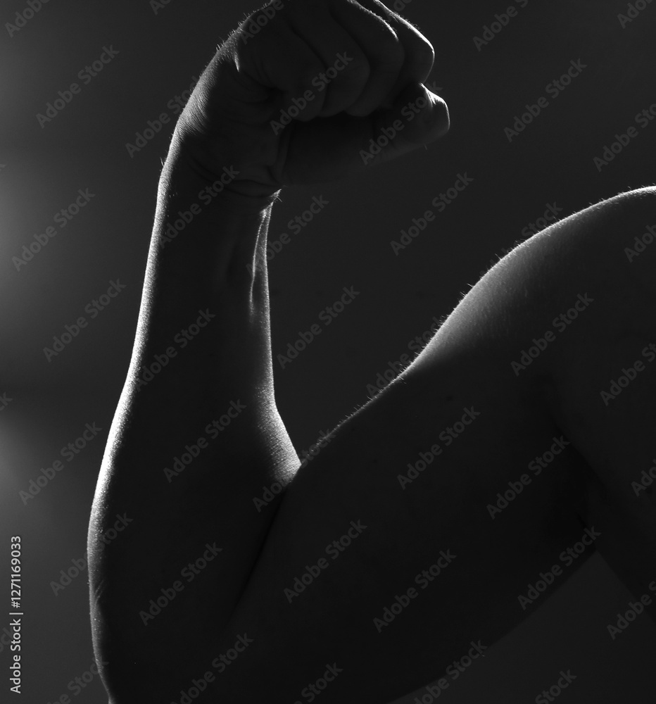 Naklejka premium Shadow strong fit man hands. Man hands. Men. Photo. Model. Background. 