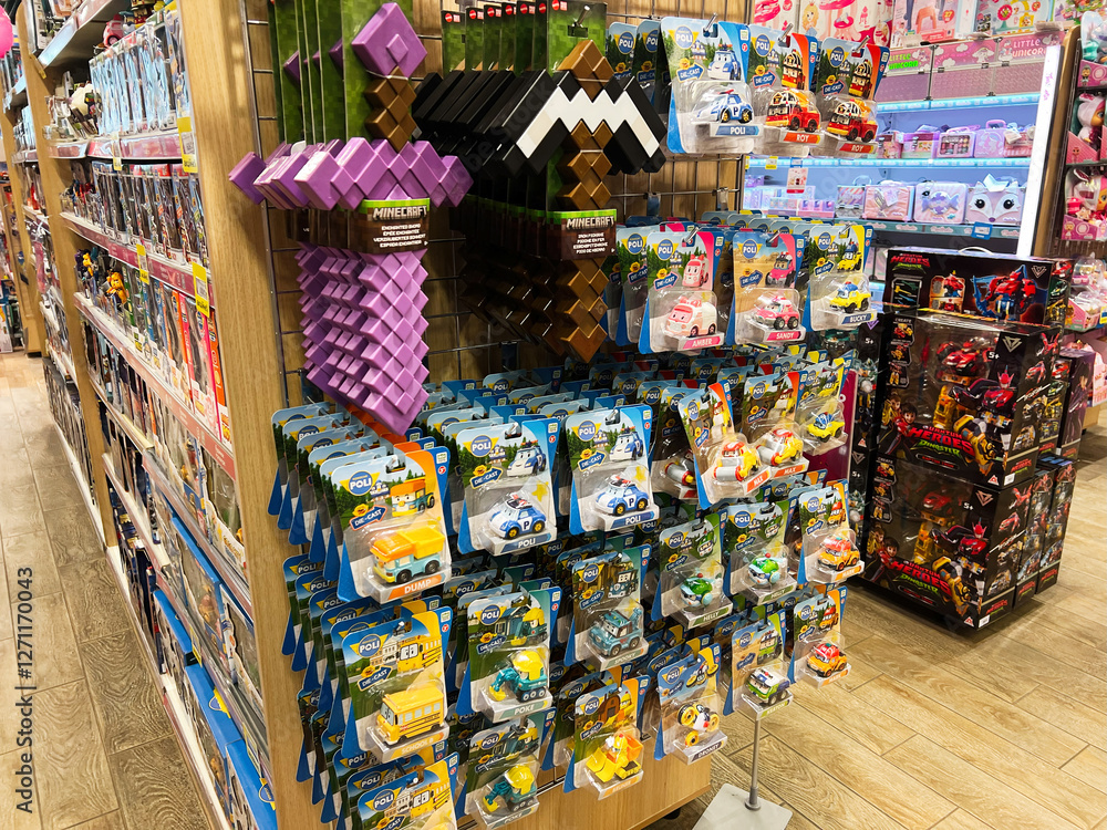 Fototapeta premium Lviv, Ukraine - February 16, 2025: Variety of toys including Minecraft and collectible cars displayed on store shelves