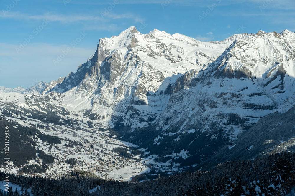 Wetterhorn Mountain and Grindelwald Village in Winter. Swiss Alps. Switzerland Wetterhorn Mountain and Grindelwald Village in Winter. Swiss Alps. Switzerland