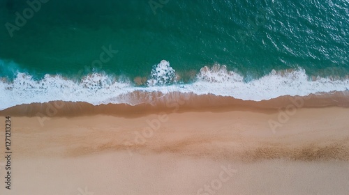 Aerial view of a pristine beach with golden sand and turquoise waves under a clear blue sky : Generative AI