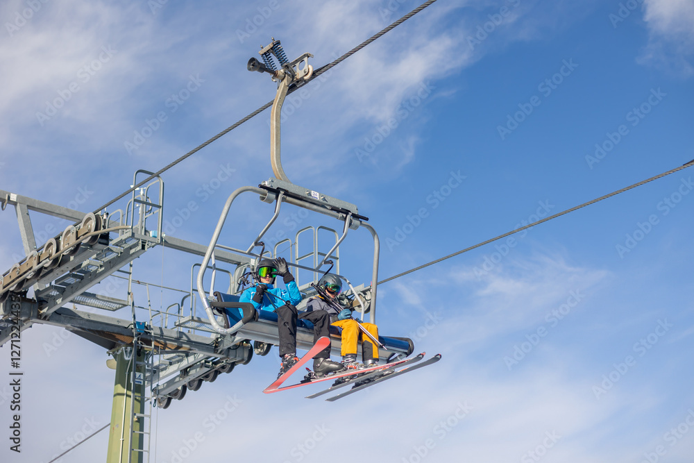 Children and adults, happy family in winter clothing at ski vacation, skiing, winter Children and adults, happy family in winter clothing at ski vacation, skiing, winter