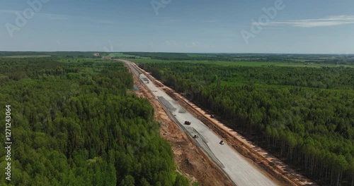 Highway construction. Construction robots preparing road surfaces.Aerial drone view.