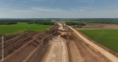 Highway construction. Construction robots preparing road surfaces.Aerial drone view.