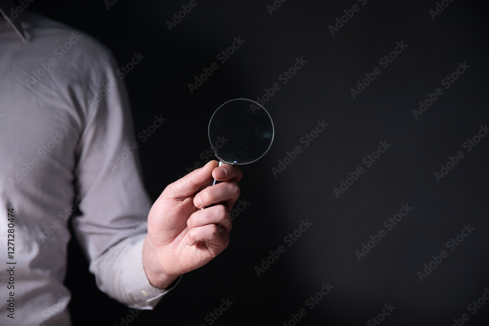 businessman with a magnifier businessman with a magnifier