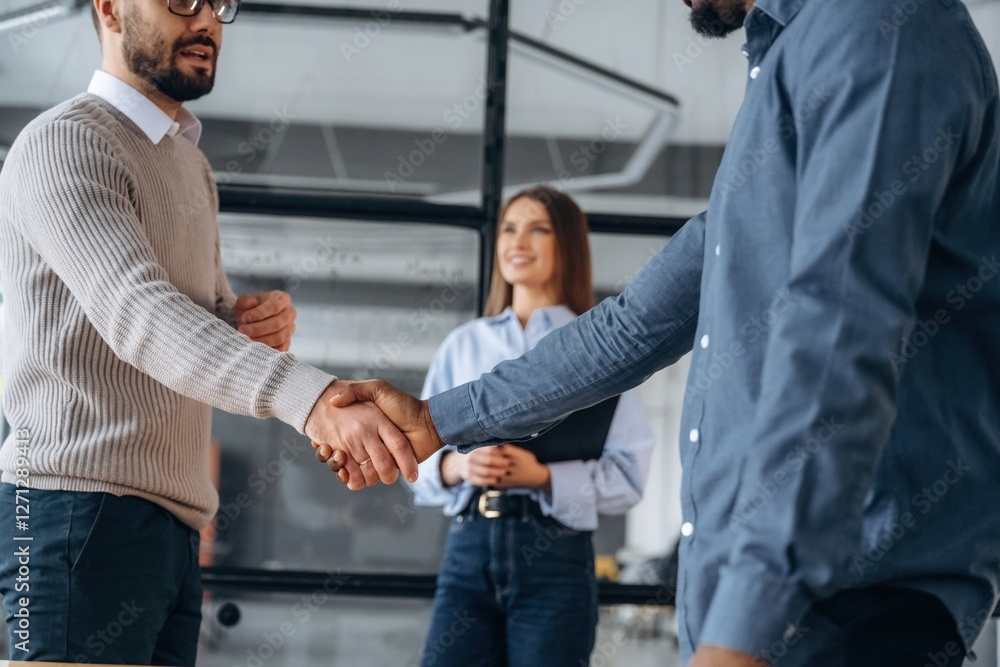 Happy to meet you, handshake. Professional workers are in the modern office together Happy to meet you, handshake. Professional workers are in the modern office together